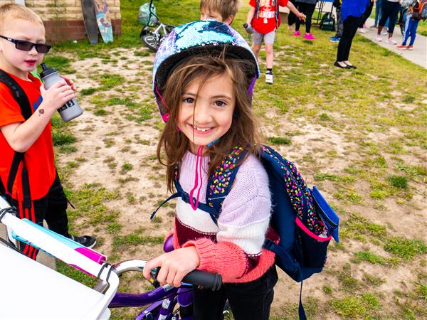 Students bike to school in the morning.